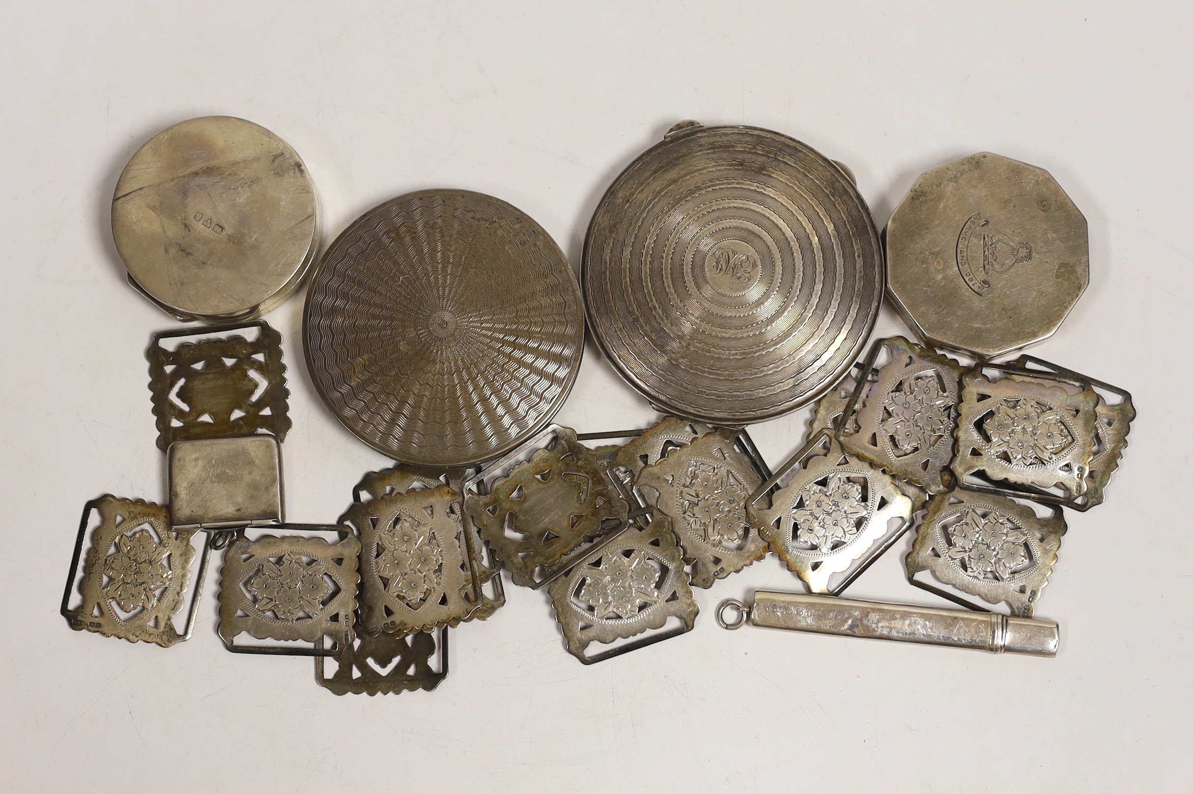 A George V silver envelope stamp case, Crisford & Norris, Birmingham, 1912, 29mm, eighteen early 20th century pierced silver belt links, four assorted silver compacts and a silver pencil holder.